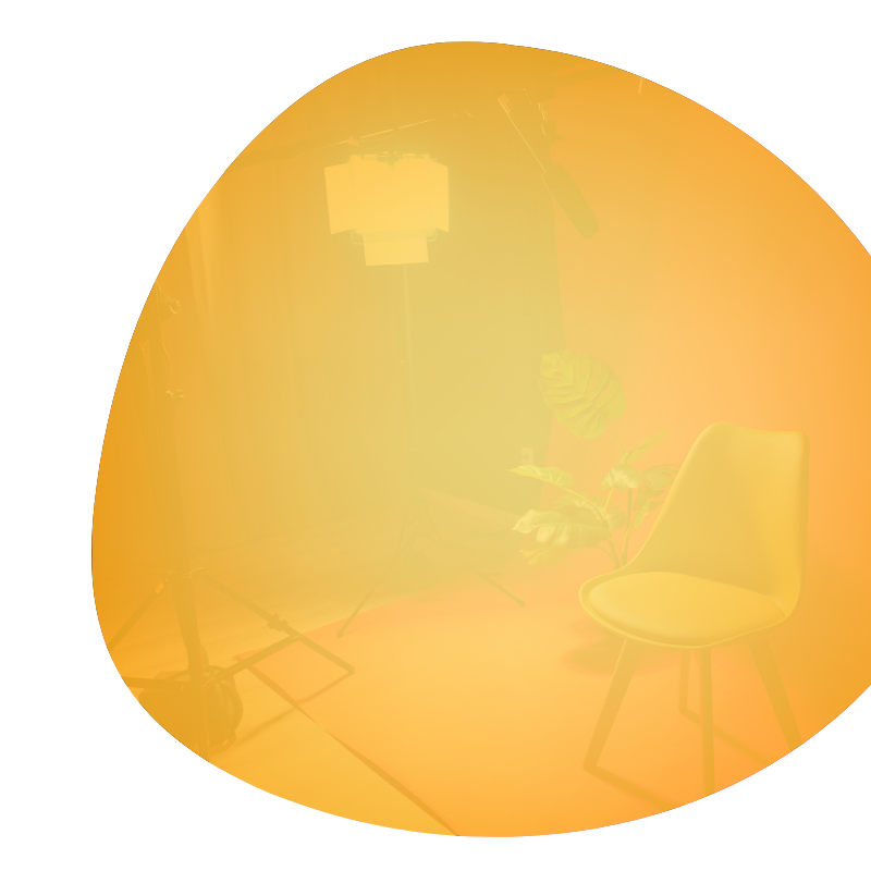 video studio with chair, lighting and plants